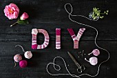 Symbolic DIY image with lettering wrapped in yarn