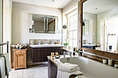 Large mirror on wall above washstand in bathroom