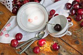 Crockery and napkin printed with patterns of cherries