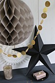 Paper Christmas decorations with origami star and garland
