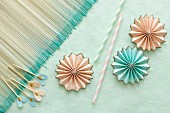 Pastel origami flowers, drinking straws & party picks for decorating table