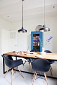 Designer chairs in industrial-style dining room
