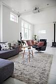 Long-pile rugs and designer furniture in living room
