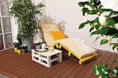 DIY side table and lounger made from pallets on terrace