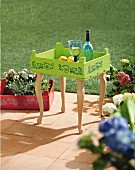 DIY tray table made from old fruit crate painted lime green
