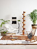 Classic chair, designer standard lamp, simple rocking chair and house plants