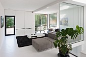 Living room with glass walls in modern building