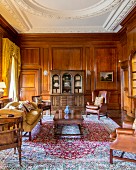 Grand interior with panelled walls and stucco ceiling