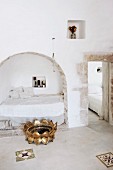 Masonry bed in niche in Mediterranean bedroom