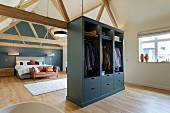Wardrobe and bed in modern bedroom