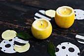 Hand-made lemon candle holders and confetti decorating table