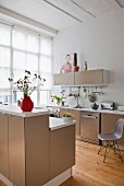 Open-plan kitchen with beige cabinets