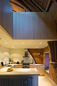 Kitchen with modern installations and gallery in converted church