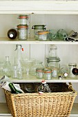 Empty preserving jars and bottles in pantry