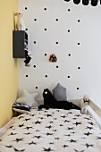 Polka-dot wall in black and white child's bedroom