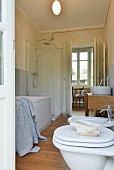 White bathroom suite in renovated country house