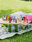 Picnic table hand-made from glass bottles and wooden boards