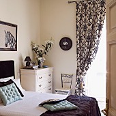 Opulent curtains in classic, black and white bedroom