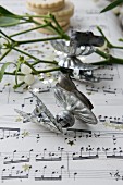 Vintage candle clips on sheet music