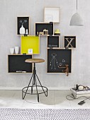 Hand-made, wall-mounted shelving made from wooden crated and chalkboard paint