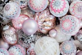 Christmas baubles and crocheted covers and made from pink mercury glass