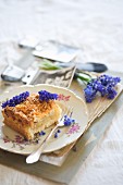 Crumb cake decorated with grape hyacinths