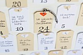 Advent calendar with hand-written, personal gift cards hand-made from paper tags