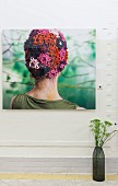 Photo of woman wearing colourful crocheted hat on wall