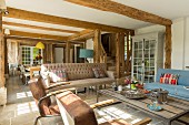 Pleasant, open-plan living area in restored half-timbered house with traditional ambiance