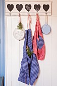 Aprons hand-made from red and blue checked linen