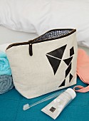 A homemade cosmetic bag with tangram shapes