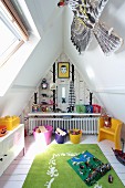 Toys in boy's attic bedroom with skylights