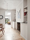 Fitted cupboards and shelving elements in living area