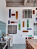 Stained glass elements in wall of loft-apartment kitchen