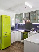 Translucent cupboards and retro fridge in modern kitchen