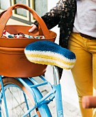 A homemade crocheted bike saddle cover made from felting wool