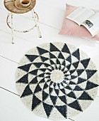 A homemade crocheted rug made from felting wool