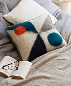 A homemade knitted cushion made from felted wool