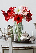 Bouquet of amaryllis of various colours on silver tray