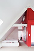 Bedroom with red wall in attic