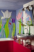 Mural of tulips in bathroom with red-painted wooden cladding and shelf