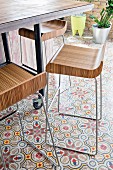 Designer bar stools on patterned cement tiles