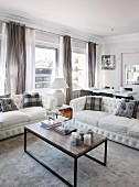 White sofas and coffee table in elegant lounge area