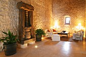 Ancient wooden press against stone wall in Mediterranean living room