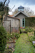 Rustic shed in autumnal garden