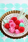 Paper roses in vintage-style dish