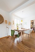 Wooden table and white shell chairs