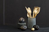 Gold cutlery and eggs painted black and gold