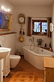 Mixture of old and new elements in bathroom of historical farmhouse