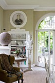Stucco elements and ornate arched French window in grand interior